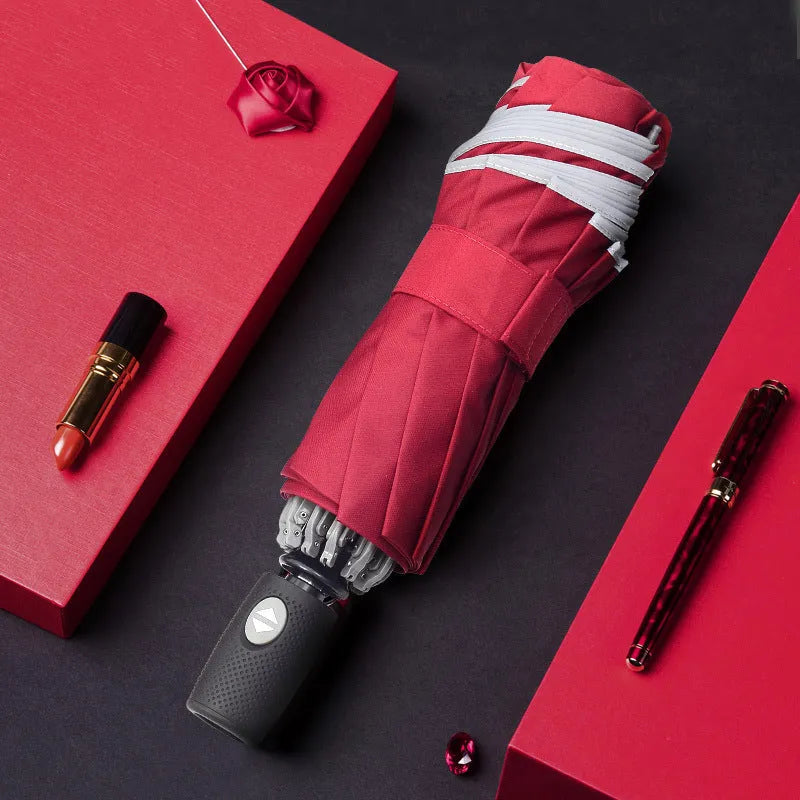 Automatic reverse umbrella with black canopy showing reverse folding design and plastic non-slip handle