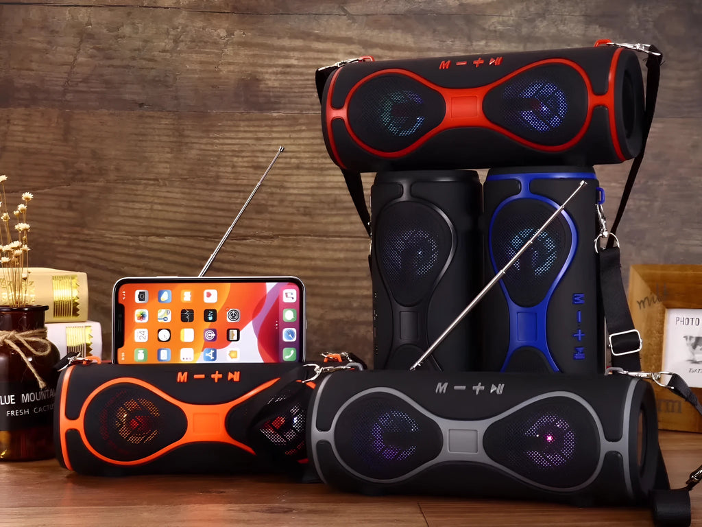 Multifunctional lantern-style Bluetooth speaker with strap in black, blue, orange, red, or silver grey.