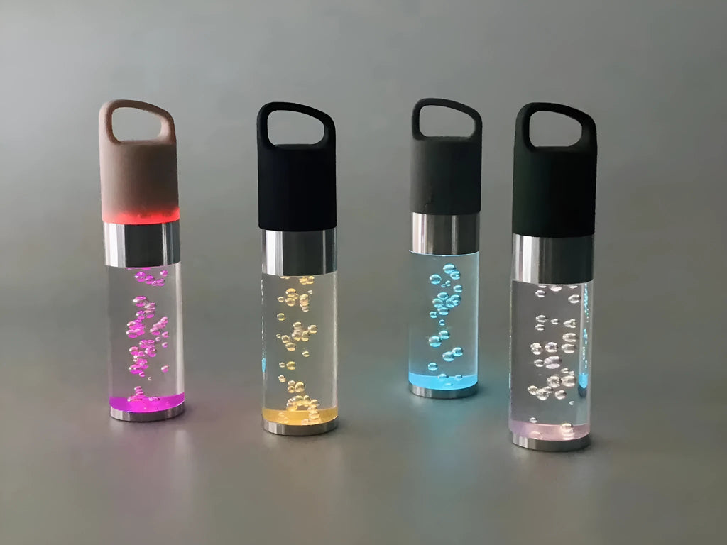 Portable Bluetooth speaker with crystal lighting in pink, black, silver grey, or green colour options
