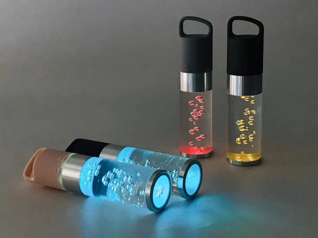 Portable Bluetooth speaker with crystal lighting in pink, black, silver grey, or green colour options