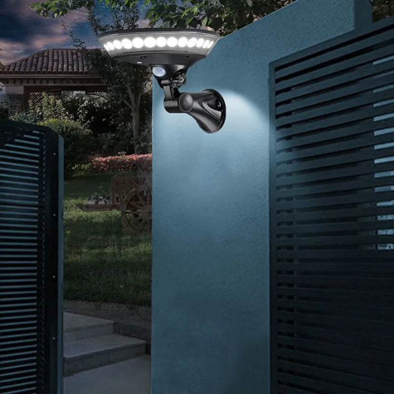 Solar-powered 360-degree outdoor security light with motion sensor mounted on wall