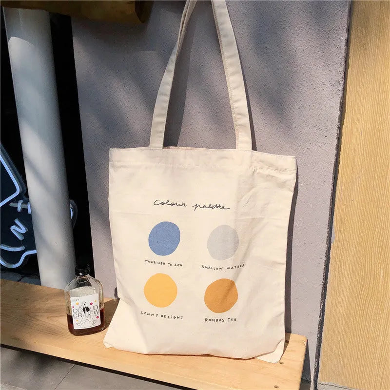 Women's canvas tote shopper bag with geometric print pattern in light pink colour showing internal pockets