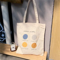 Women's canvas tote shopper bag with geometric print pattern in light pink colour showing internal pockets