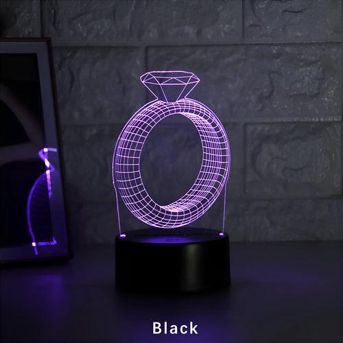 3D diamond ring LED night light with colour-changing acrylic panel on ABS plastic base.