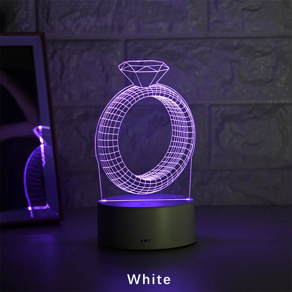 3D diamond ring LED night light with colour-changing acrylic panel on ABS plastic base.