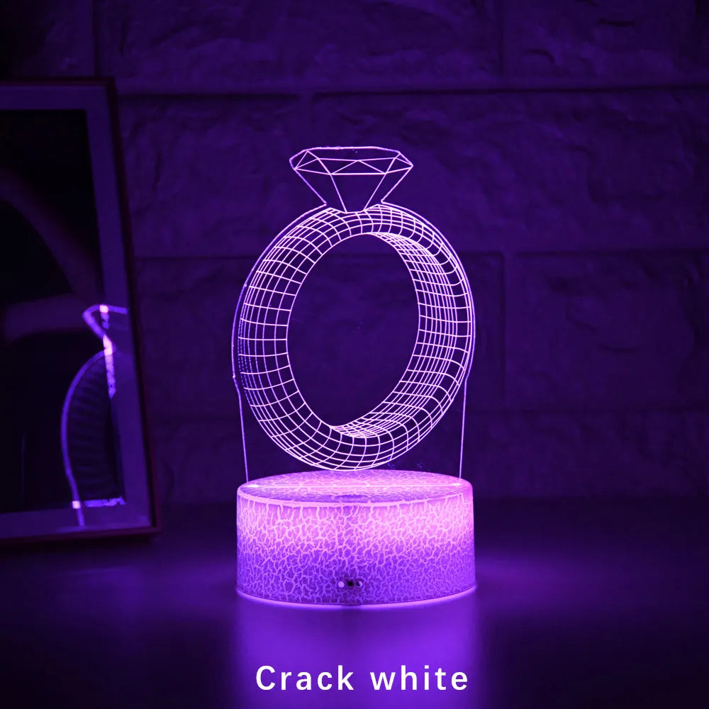 3D diamond ring LED night light with colour-changing acrylic panel on ABS plastic base.