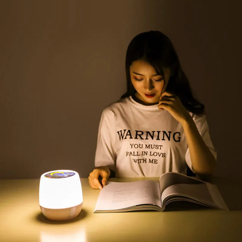 Pruixin rotating projector night light showing star patterns on a wall with remote control.