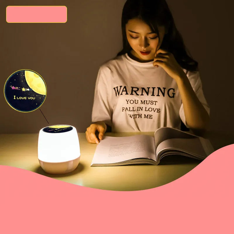 Pruixin rotating projector night light showing star patterns on a wall with remote control.