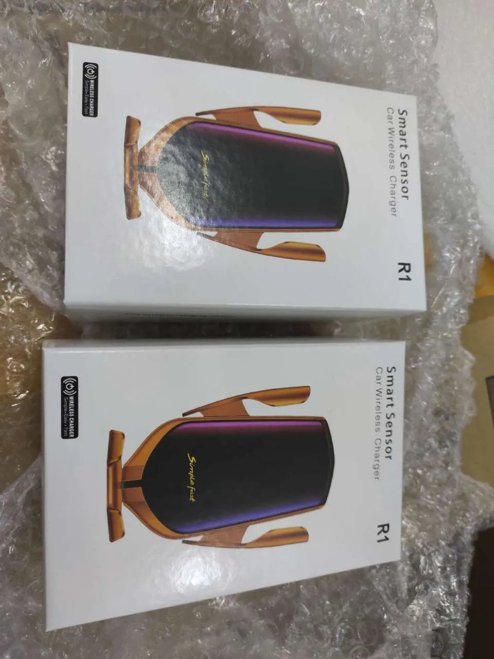 Magic Clip R1 automatic wireless charging car phone holder in gold or silver on car dashboard