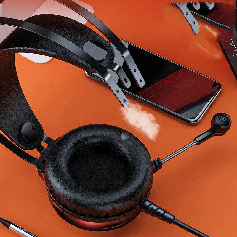 Black wired PC gaming headset with microphone and large protein earmuffs, showing 3.5mm plug.