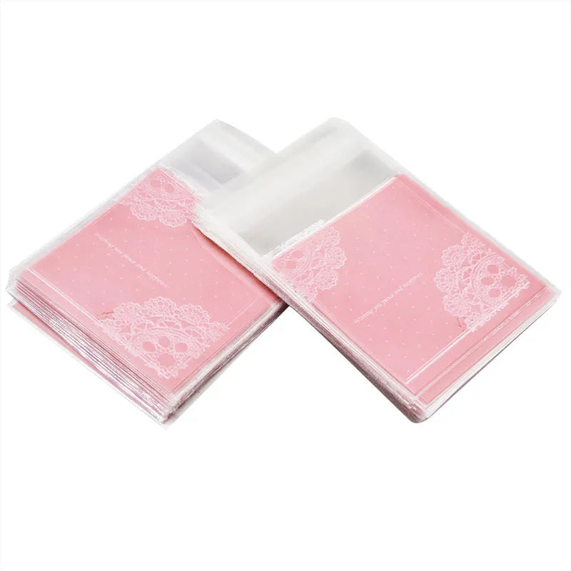 Pink self-adhesive plastic packaging bags for handmade soap, shown with dimensions 7cm by 7cm.