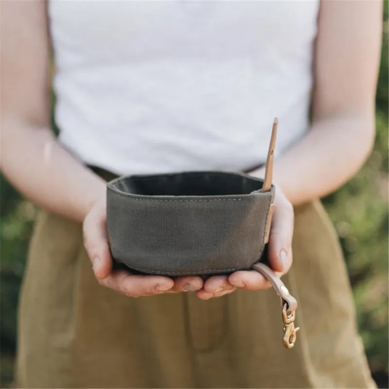 Waterproof foldable travel dog bowl in oil wax canvas, round 150x75mm, shown in green or grey