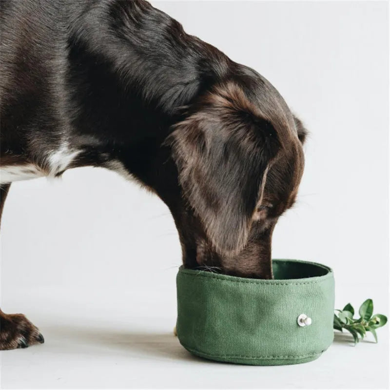 Waterproof foldable travel dog bowl in oil wax canvas, round 150x75mm, shown in green or grey