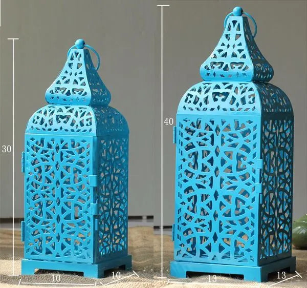 Blue retro iron candelabrum with geometric pattern and Moroccan lantern shape for tea light candles.