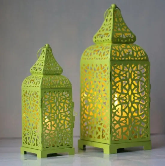 Blue retro iron candelabrum with geometric pattern and Moroccan lantern shape for tea light candles.