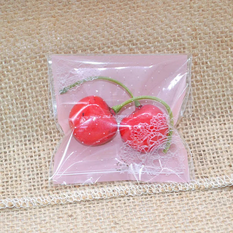 Pink self-adhesive plastic packaging bags for handmade soap, shown with dimensions 7cm by 7cm.