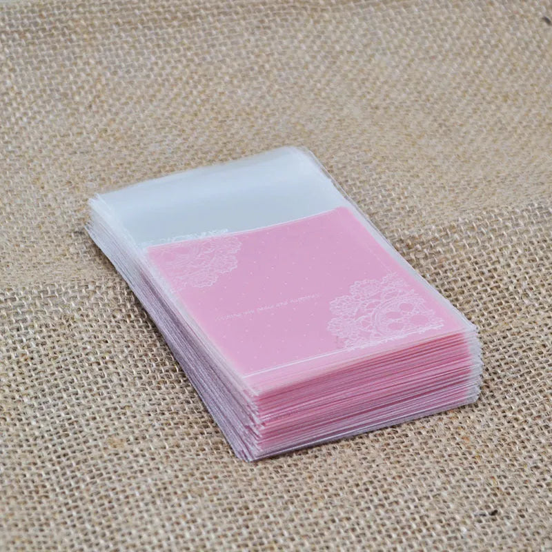 Pink self-adhesive plastic packaging bags for handmade soap, shown with dimensions 7cm by 7cm.