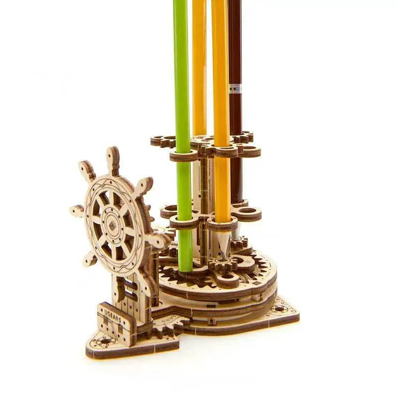 Wooden steering wheel model pen holder rotating on a desk with pens.