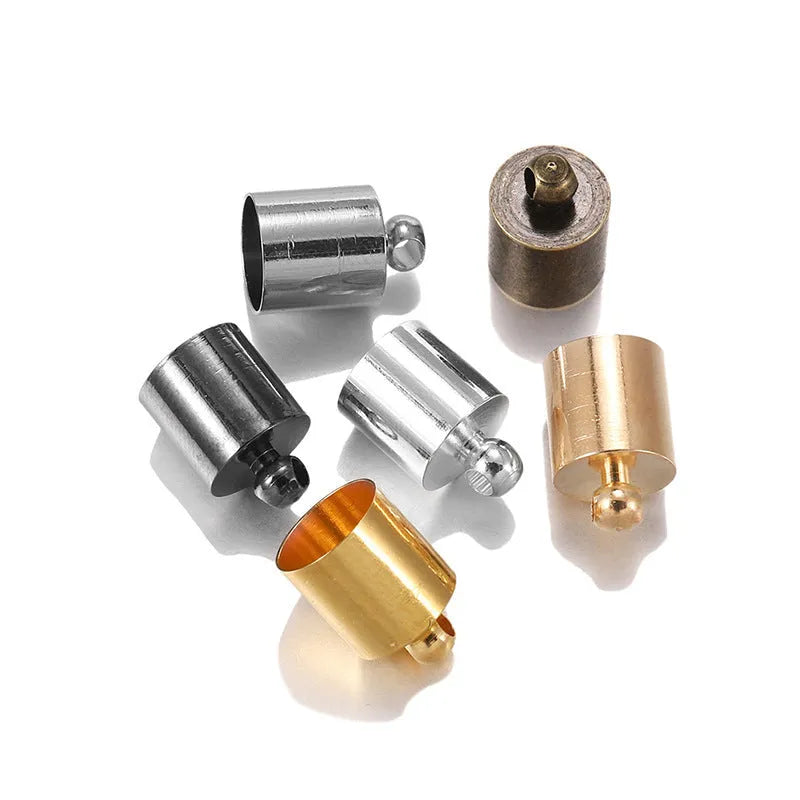 Assorted copper pendant caps in gold, silver, bronze and black finishes, showing weight, bell and tassel styles.