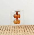 Retro stained glass gourd vase in green, pink, or yellow for hydroponic flowers on a countertop
