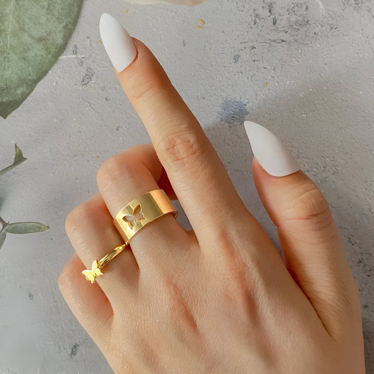 Two-piece butterfly ring set in alloy with electroplated gold or silver finish and adjustable open ring design