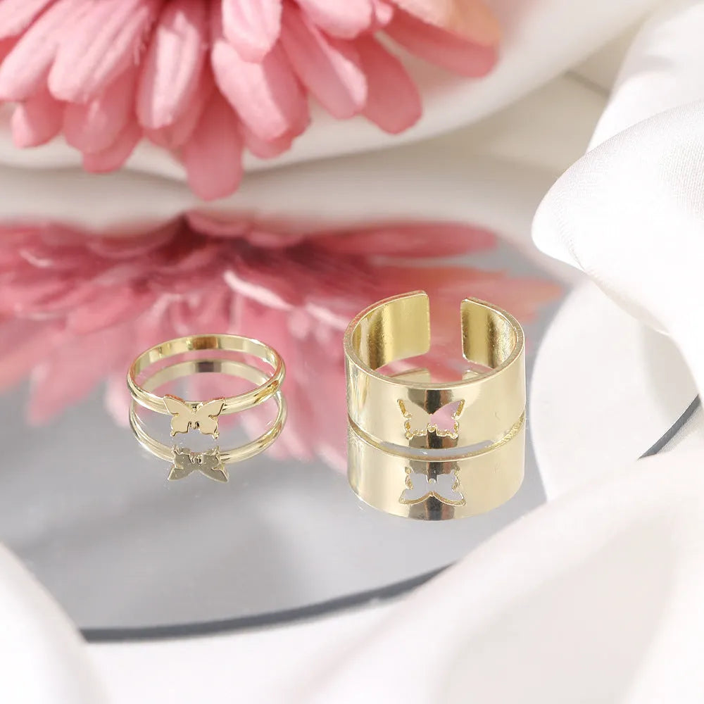 Two-piece butterfly ring set in alloy with electroplated gold or silver finish and adjustable open ring design