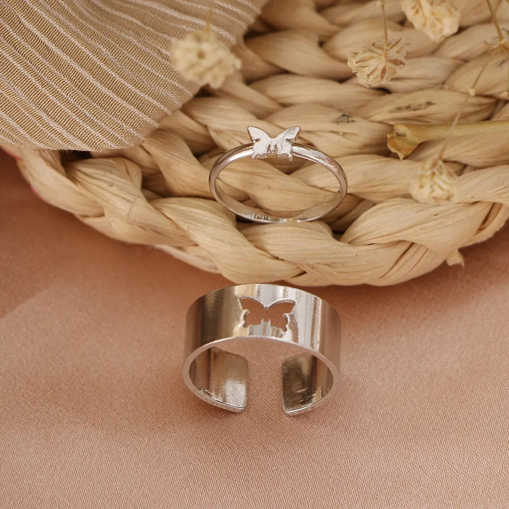 Two-piece butterfly ring set in alloy with electroplated gold or silver finish and adjustable open ring design