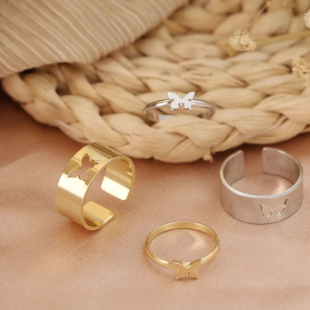 Two-piece butterfly ring set in alloy with electroplated gold or silver finish and adjustable open ring design