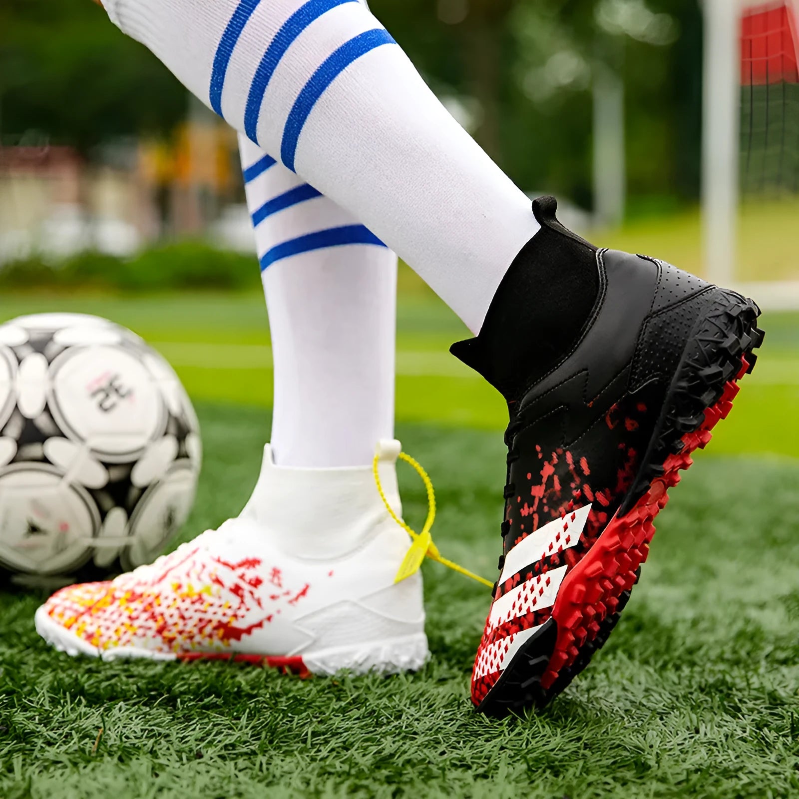 Black long-nail football boots with PU upper and rubber outsole for grass training
