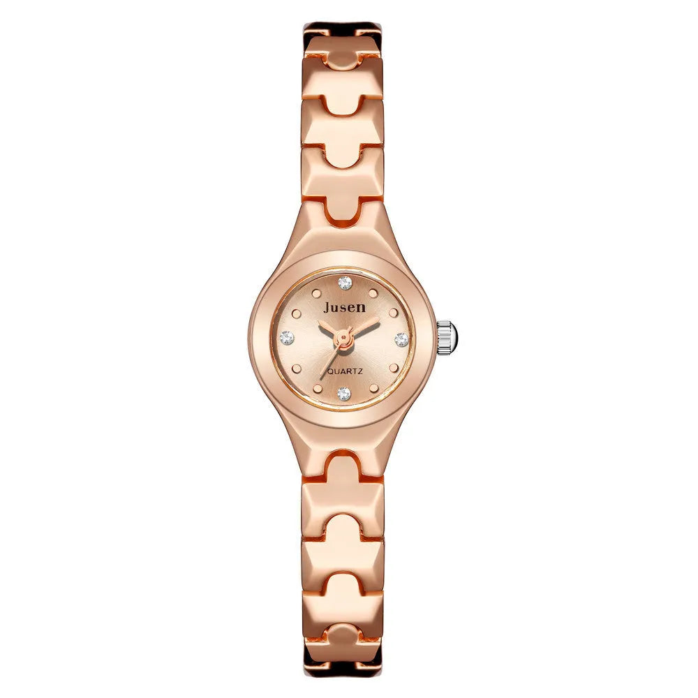Small round ladies quartz bracelet watch with alloy case, alloy strap, stainless steel horseshoe buckle, and 20mm dial.