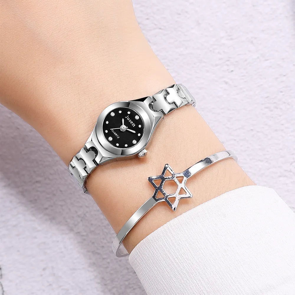 Small round ladies quartz bracelet watch with alloy case, alloy strap, stainless steel horseshoe buckle, and 20mm dial.