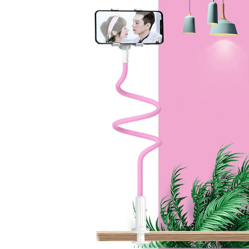 Blue mobile phone holder with flexible memory alloy hose mounted on a bed headboard, holding a smartphone.