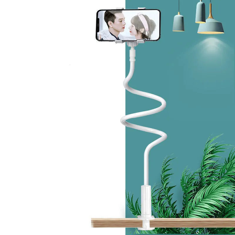 Blue mobile phone holder with flexible memory alloy hose mounted on a bed headboard, holding a smartphone.