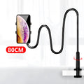 Blue mobile phone holder with flexible memory alloy hose mounted on a bed headboard, holding a smartphone.