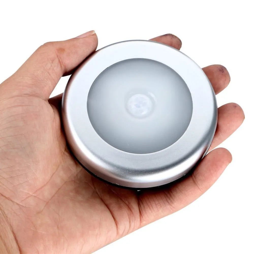 Silver battery-powered motion sensor night light with 80mm diameter PC plastic lampshade