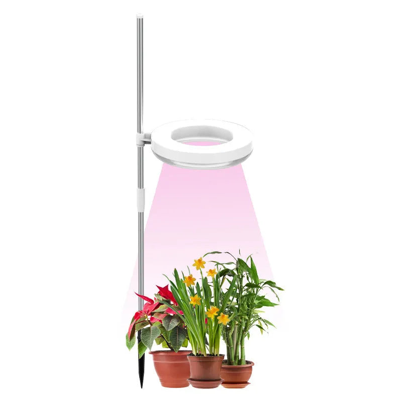 Full spectrum LED plant growth lamp with PC shell on desk with indoor plants