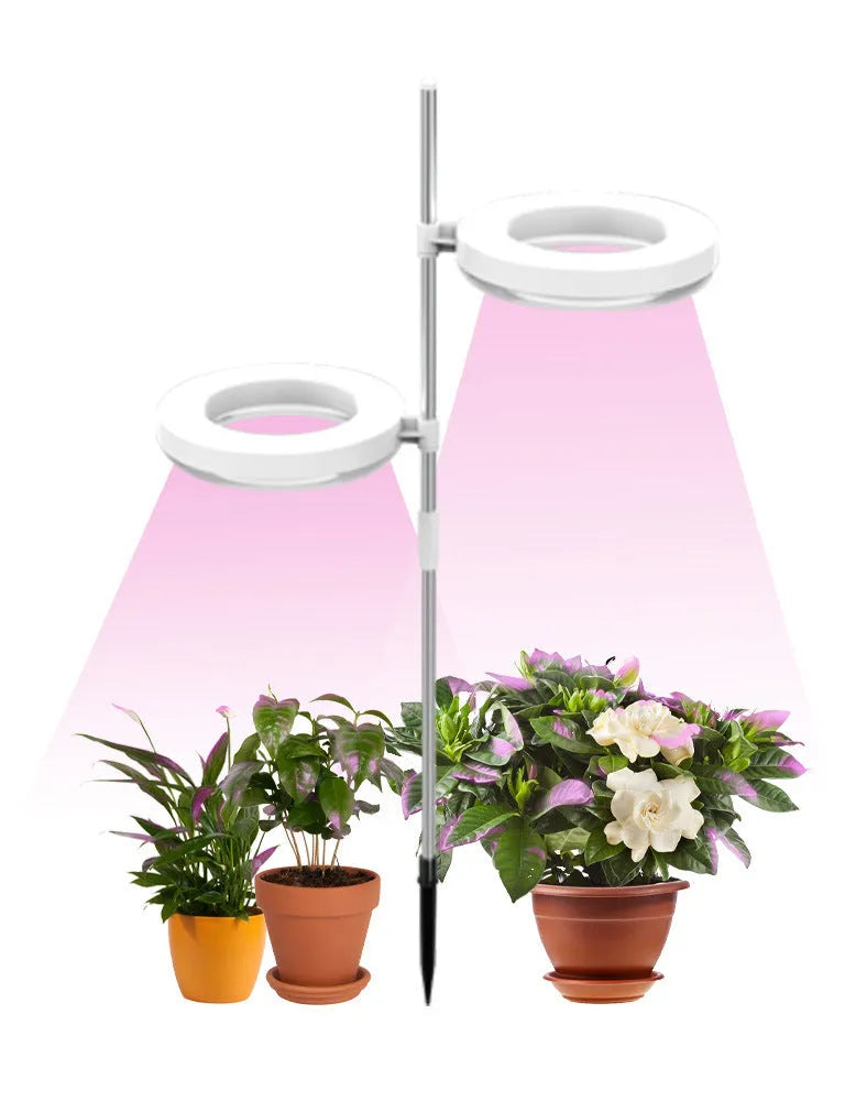 Full spectrum LED plant growth lamp with PC shell on desk with indoor plants