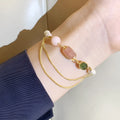 Women's freshwater pearl bracelet with geometric design and strawberry crystal accents