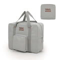 Black cube-shaped travel storage bag with sealable closure made from Oxford cloth