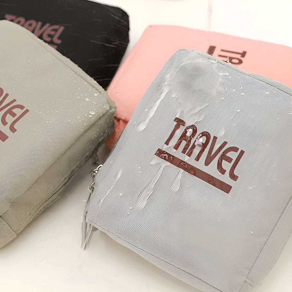 Black cube-shaped travel storage bag with sealable closure made from Oxford cloth