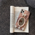 Brown marble pattern silicone iPhone case with bowknot rhinestone accents and integrated mirror