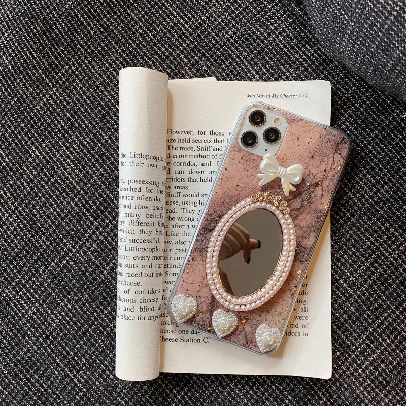 Brown marble pattern silicone iPhone case with bowknot rhinestone accents and integrated mirror