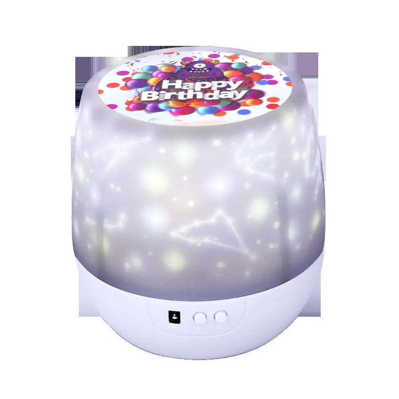 Starry sky projection lamp showing cosmic patterns on a wall, with plastic housing and USB cable.