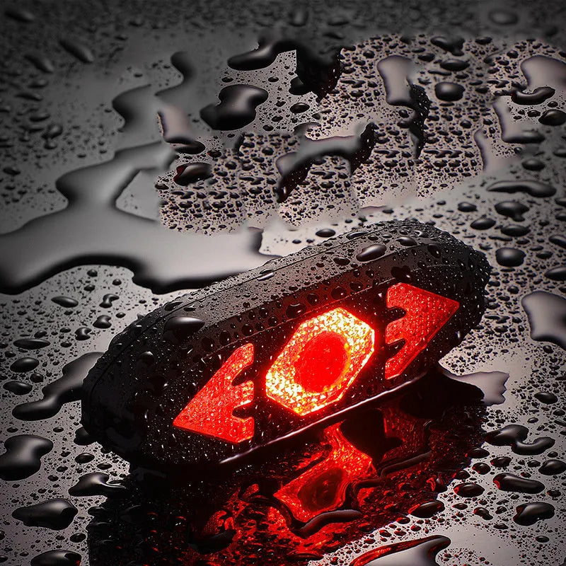 Black wireless remote control LED bike tail light with turn signals and horn, 95x33x22mm