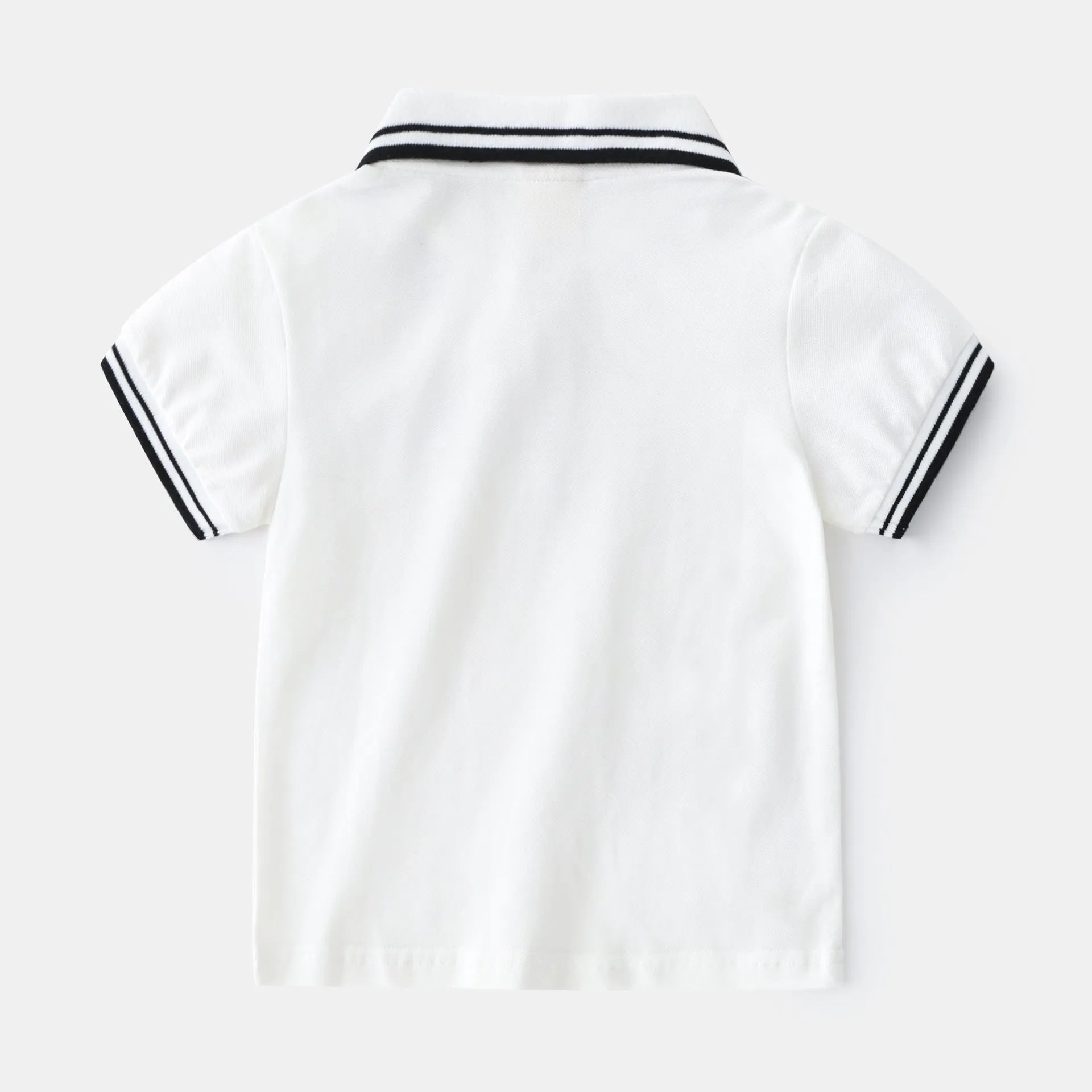 Boys white and black cotton polo shirt with short sleeves and a round neck