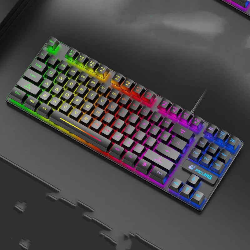 Black, white, blue, and pink coloured mechanical keyboards on a desk