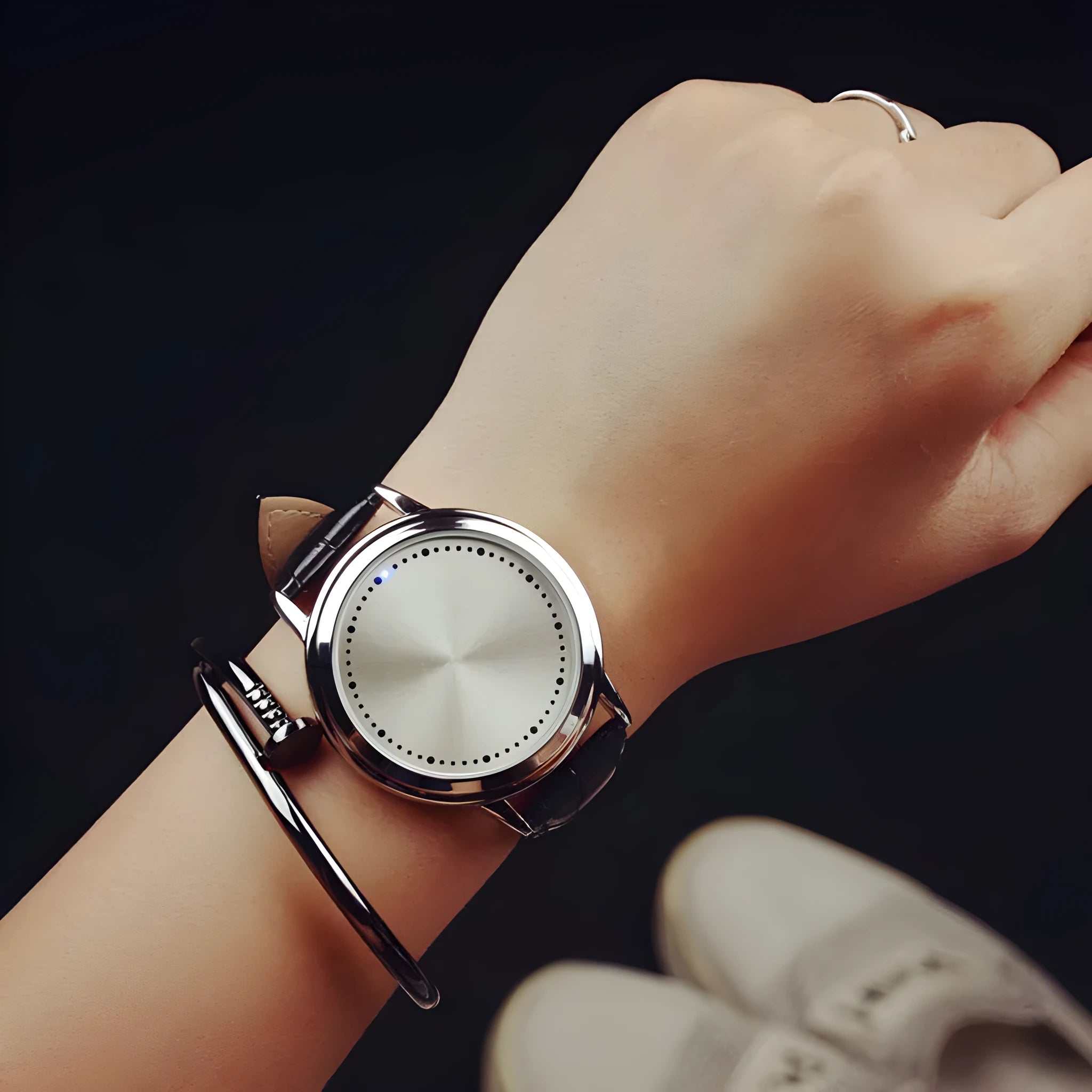 Casual digital watch with blue light effect on display, shown in black and white colour options.