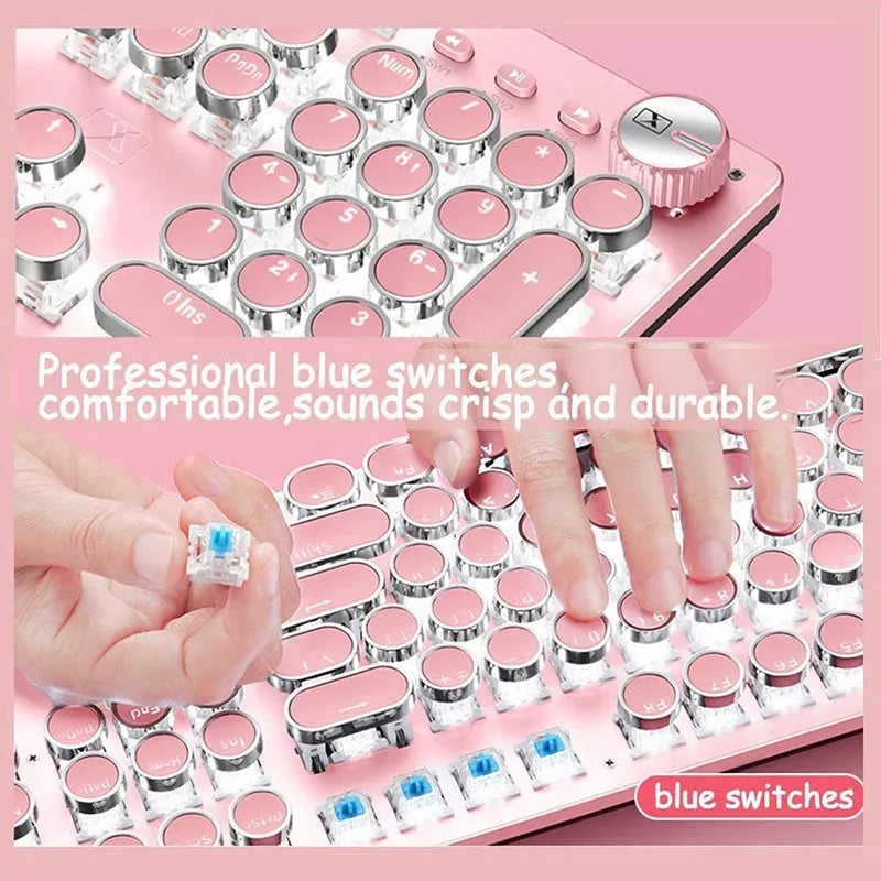 Queen Lipstick mechanical keyboard with green switches, silver bottom, and pink backlight on desk