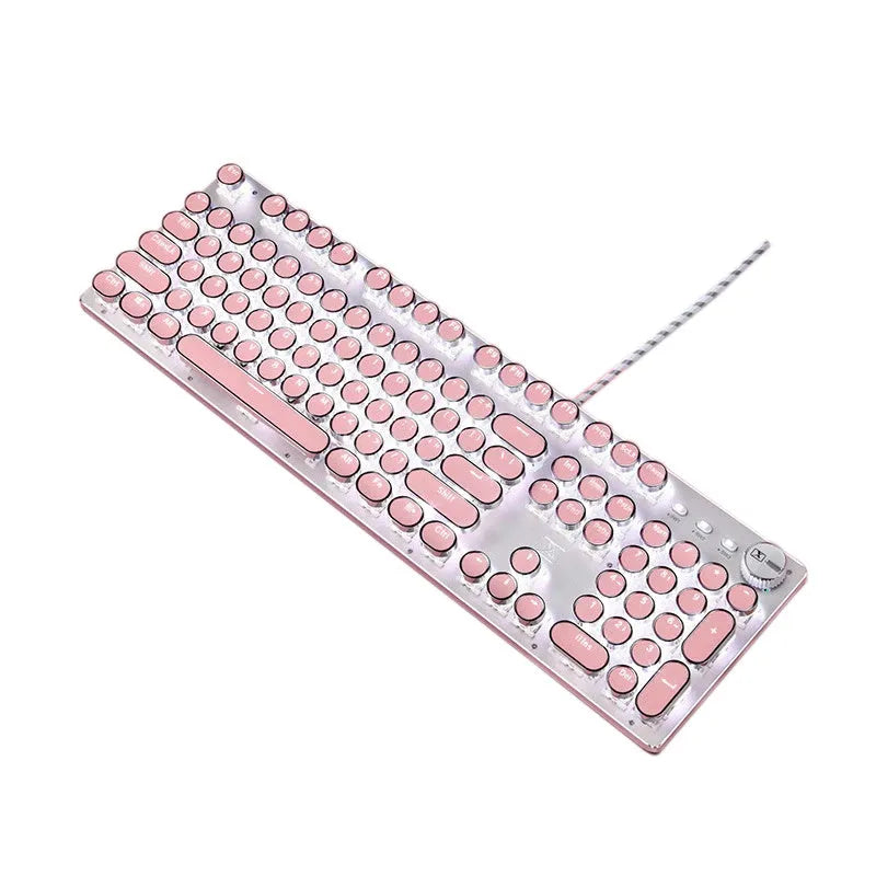 Queen Lipstick mechanical keyboard with green switches, silver bottom, and pink backlight on desk