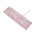 Queen Lipstick mechanical keyboard with green switches, silver bottom, and pink backlight on desk